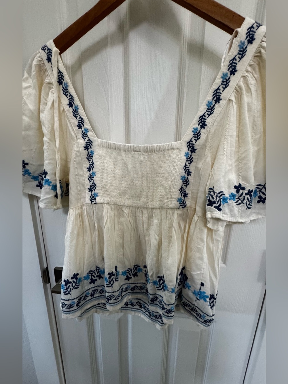 Old Navy. New. Cream Peasant Blouse with Blue Embroidery